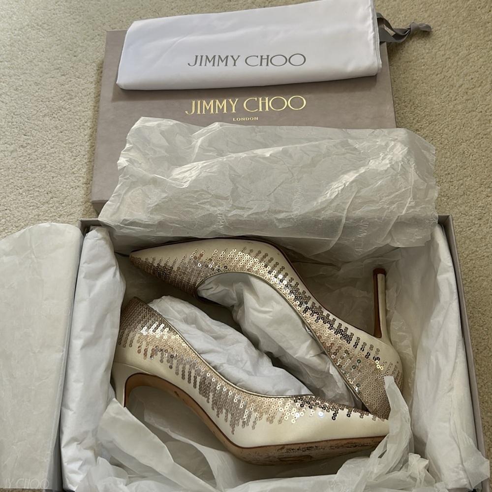 Jimmy Choo Romy 85 size 38.5 (US 8) ivory/platinum
Locket pressed conditioner